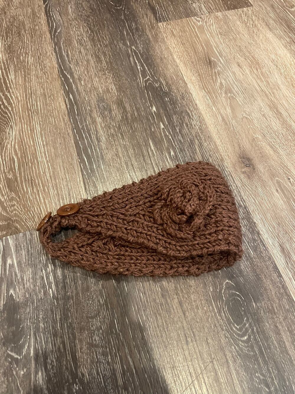 brown knit head band with flower attached